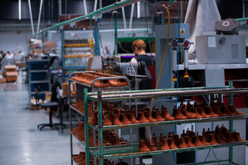 Shoe making process in footwear factory.