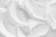 White cosmetic foam texture background. Thick mousse, cleanser, shaving foam, shampoo lather. Creamyy skincare product closeup.