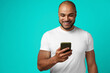 © fotofabrika - Young african american man making video call with his smartphone