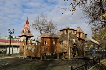 Wooden playground on Tverskoy Boulevard, Moscow city, Russia. Children's active games at playground. Improvement of public spaces. Moscow landmark, architecture, view