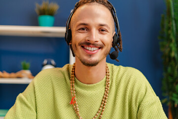 Portrait of a young guy with headset, customer service worker