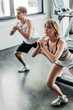 © LIGHTFIELD STUDIOS - selective focus of young sport couple working out in gym