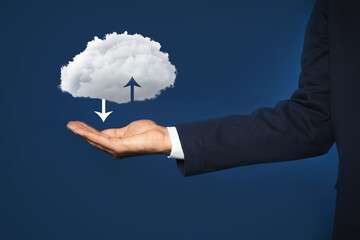 Modern storage technology concept. Man holding cloud on blue background, closeup