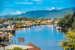 Lawas, Sarawak, Malaysia cityscape with river and mountain background