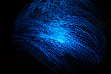 Wall Mural - blue abstract particles and lines with bokeh and blur in dark background.
