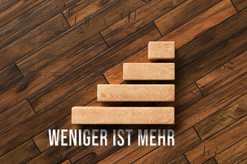Wall Mural - cubes and German message for LESS IS MORE on wooden background