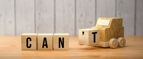 Wall Mural - wooden forklift is transporting off a cube to alter a message from CAN'T to CAN