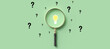 © fotogestoeber - magnifying glass with lightbulb as symbol for finding a solution on light green background