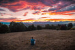 © Bar - Man watching sunset sky panoramic view