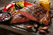 Medium Rare Ribeye steak on wooden board