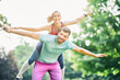 © Lumos sp - fitness woman park exercise lifestyle outdoor sport healthy couple nature active young fit fun piggyback