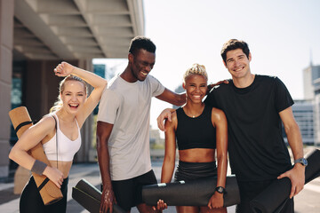 Wall Mural - Healthy fitness group standing outdoors