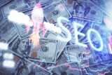 Fototapeta Mapy - Double exposure of seo drawing over us dollars bill background. Concept of search optimization.