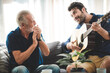 © chokniti - senior father and about son having fun and happy at home, living at home with family