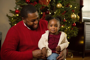 happy african american father and his daughter.