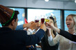 © torsakh - Business people or team or friend or colleagues are drinking together with glass of champagne or alcohol in party after work, happy new year celebration fun in office