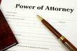 © Neil - Power Of Attorney form with pen and lawbook.