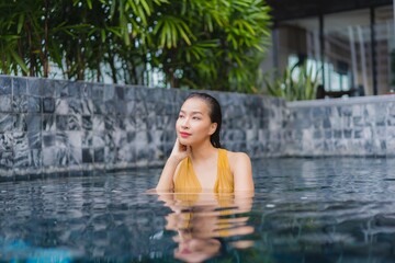  Portrait beautiful young asian woman relax leisure around swimming pool
