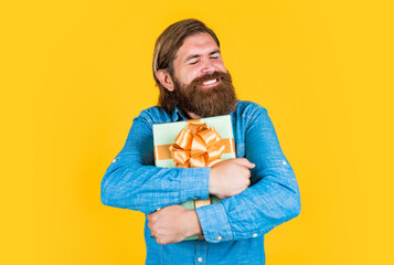 Delighted man shopping online. boxing day. birthday surprise at party. after successful shopping. prepare for holidays. best sale offer. happy bearded man with present box. brutal hipster hold gift