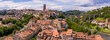 Aerial views of the rooftops, landmarks, river and bridges of the old town of Fribourg in Switzerland.