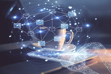 Desktop computer background in office and flying envelops hologram drawing. Double exposure. Electronic mail concept.