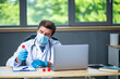 © All king of people - profesional doctor working at his desk collecting data