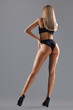 © serhiibobyk - Incognito woman on heels posing in lingerie.