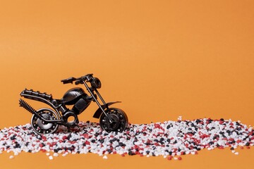 Poster - toy model of a sports motorcycle on an orange background