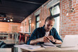 © LIGHTFIELD STUDIOS - selective focus of concentrated businessman looking at notebook near laptop