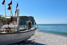 Fishing Boat On The Beach Near The Famous Cliffs Of Etretat, Normandy, France.