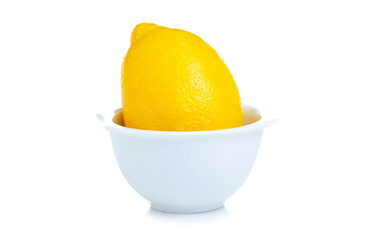 Wall Mural - Lemon in white bowl on white background isolation