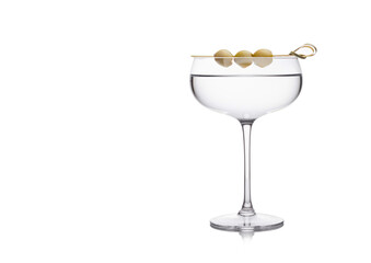 vodka martini gin cocktail in luxury crystal glass with olives on bamboo stick on white background w