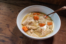 Top View Bowl Of Homemade Chicken And Dumplings With Carrots