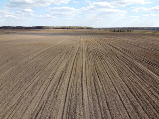 Treated farm field, aerial view. Agricultural land.