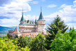 © lubos K - View of neogothic Bojnice castle over treetops of Castle park (Bojnice, Slovakia)