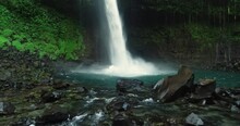 La Fortuna Waterfall In The Rainforest Near Arenal Volcano In Costa Rica, Central America. Beautiful Nature Landscape At Toursit Travel Destination Landmark.