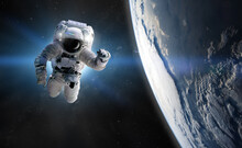 Astronaut At Spacewalk. Concept Of Conquering The Universe By The Human Race. Elements Of This Image Furnished By NASA