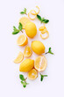 Fresh lemons and mint leaves on white background. Top view
