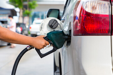 Hand Man Refill and filling Oil Gas Fuel at station. Gas station - refueling.To fill the machine with fuel. Car fill with gasoline at a gas station. Gas station pump. 