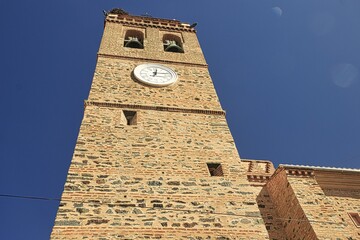 Sticker - Low angle shot of an old brick clock tower and clear blue sky - perfect for background