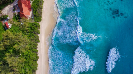 Wall Mural - Tropical beach with sea and palm taken from drone. Seychelles famous beach - aerial photo of La Digue Grand Anse