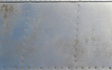 old rusty metal aluminium background with rivets