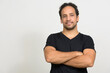 © Ranta Images - Portrait of handsome bearded Hispanic man with curly hair