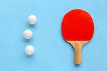 Red Racket For Table Tennis With White Balls On Blue Background. Ping Pong Sports Equipment In Minimal Style. Flat Lay, Top View, Copy Space