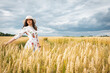 © Jurii - Portrait of a girl in a wheat field. Portrait of a beautiful girl in a white dress and hat on a wheat field. Girl in a white dress and hat. Wheat field. Portrait of a young woman in nature
