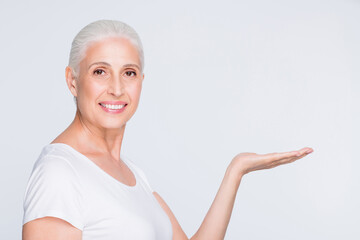 Sticker - Close-up portrait of her she nice-looking attractive cheerful cheery confident content gray-haired lady holding on palm sale discount isolated on light white grey background