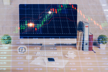 Forex graph hologram on table with computer background. Double exposure. Concept of financial markets.