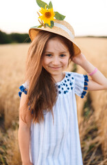 Poster - cute girl in hat with sunflower