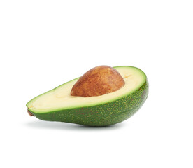 Wall Mural - half ripe green avocado with a brown pit isolated on a white background