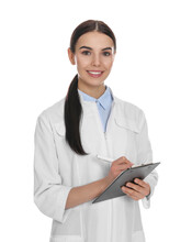 Happy Young Woman In Lab Coat With Clipboard On White Background